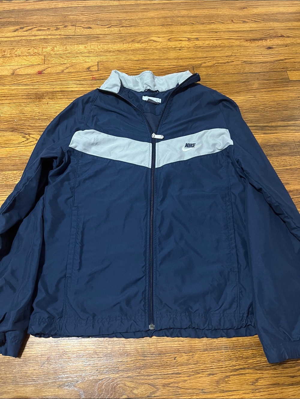 Vintage Nike Men’s Navy Blue Windbreaker with White Chest Stripe